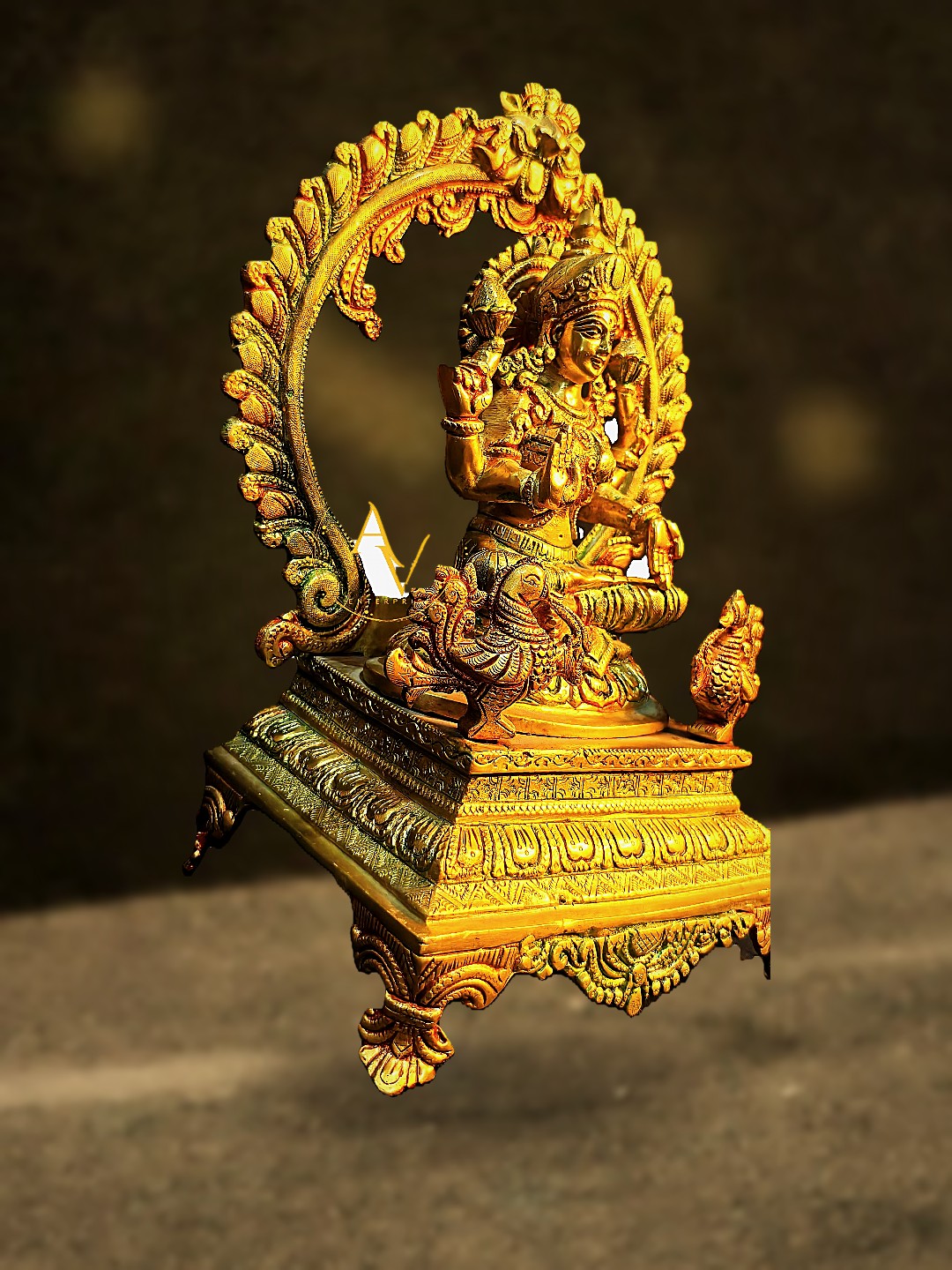 Ornate hand-carved brass Krishna idol seated on a detailed arch throne
